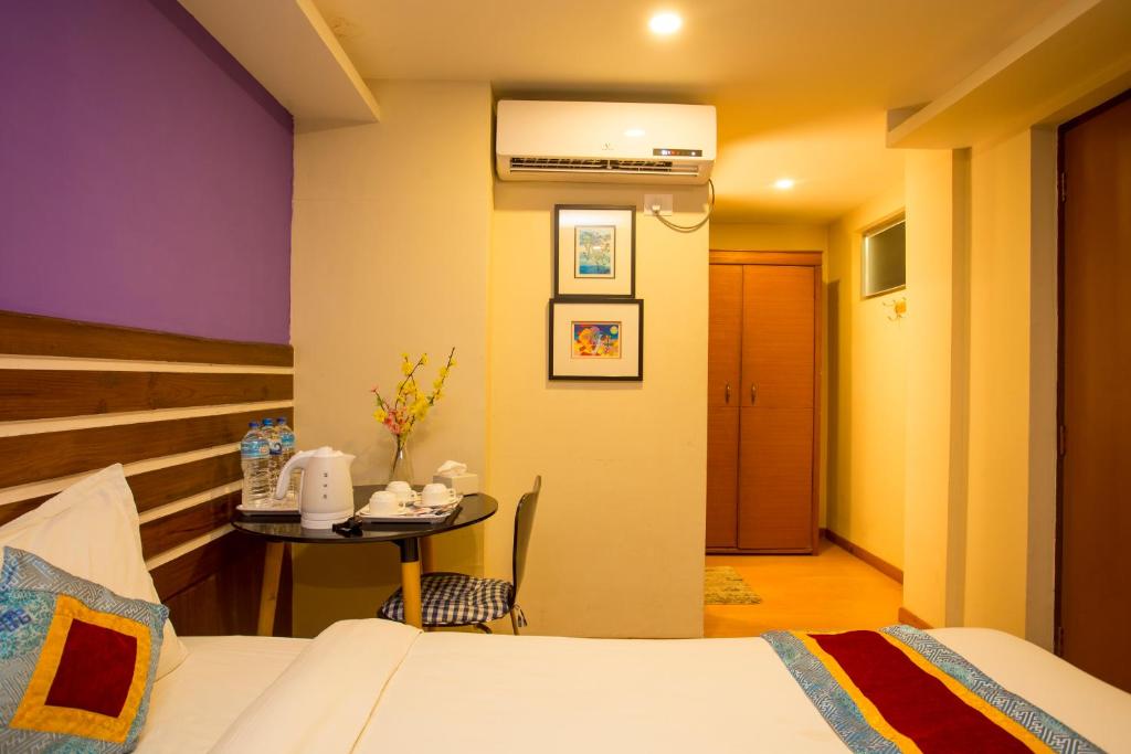 Postel nebo postele na pokoji v ubytování Asian Boutique Hotel