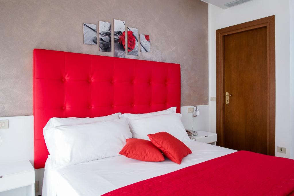 Postel nebo postele na pokoji v ubytování Hotel Picobello Pineta