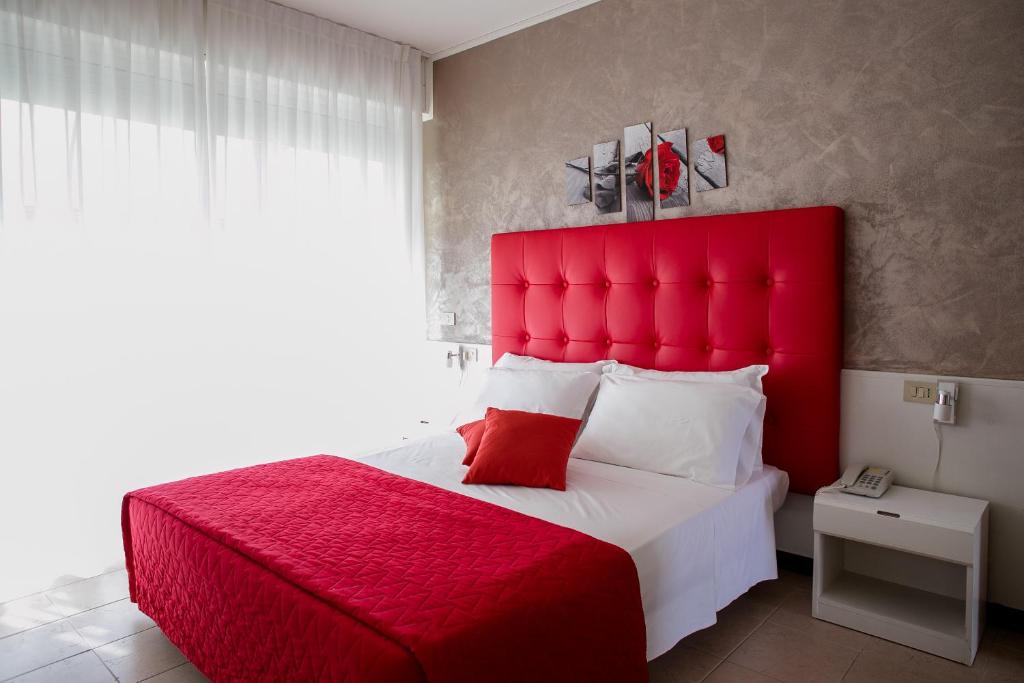 Postel nebo postele na pokoji v ubytování Hotel Picobello Pineta