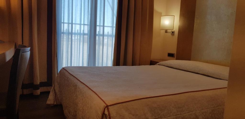 Posteľ alebo postele v izbe v ubytovaní Hotel Tiffany Milano