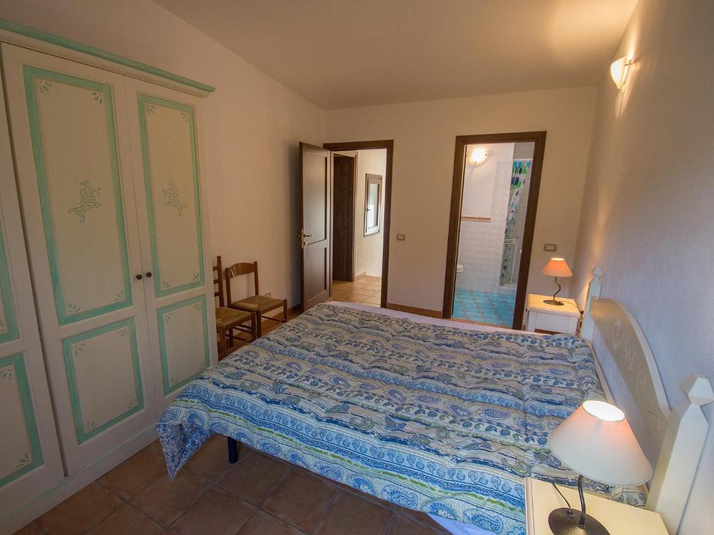 Postel nebo postele na pokoji v ubytování Residence Cala Petralana
