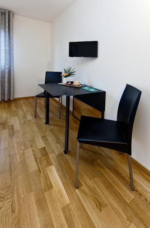 TV a/nebo společenská místnost v ubytování Hotel Wolf