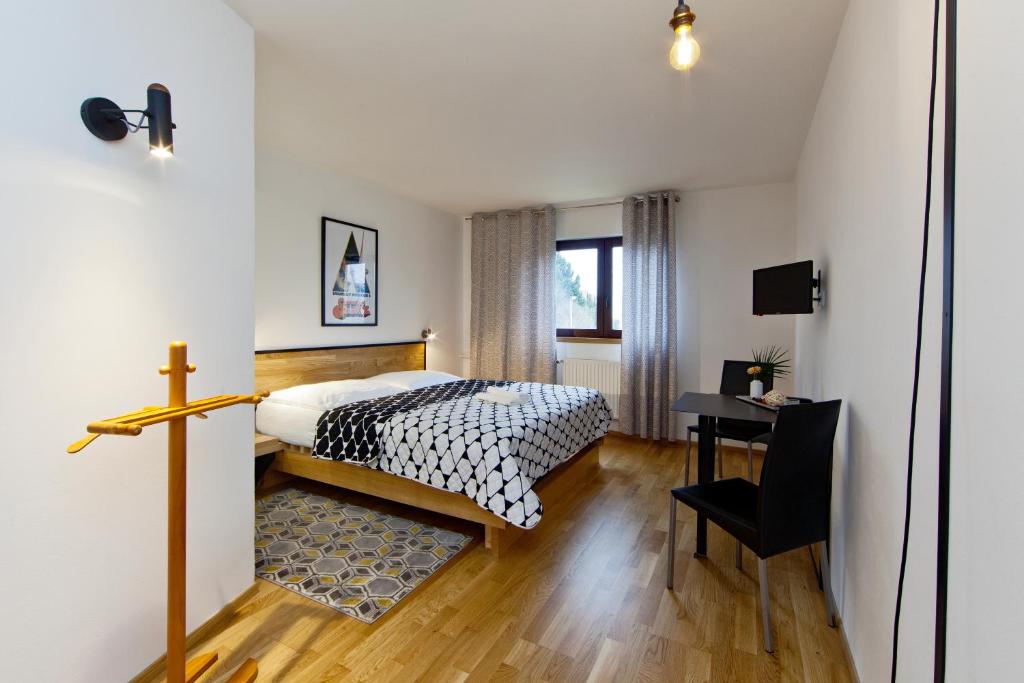 Postel nebo postele na pokoji v ubytování Hotel Wolf