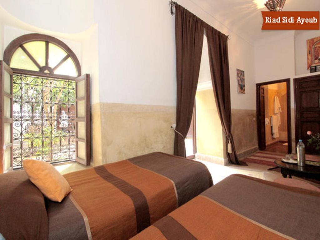 Postel nebo postele na pokoji v ubytování Riad Sidi Ayoub