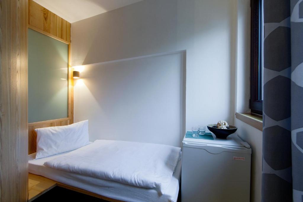 Postel nebo postele na pokoji v ubytování Hotel Wolf
