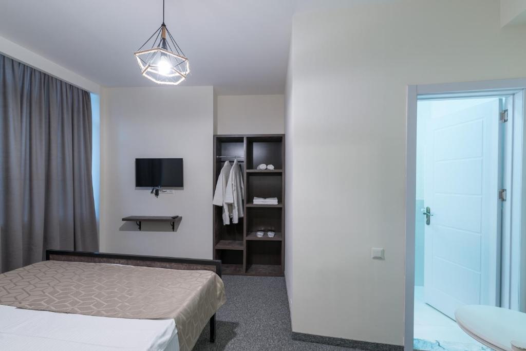 Postel nebo postele na pokoji v ubytování Hotel Opinion