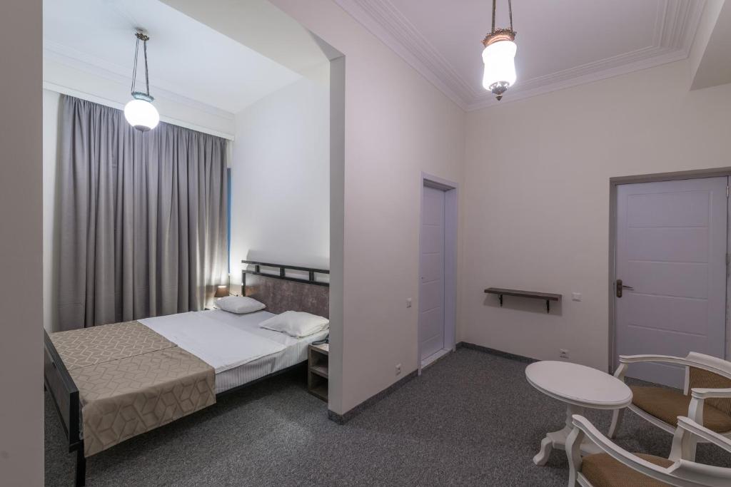 Postel nebo postele na pokoji v ubytování Hotel Opinion