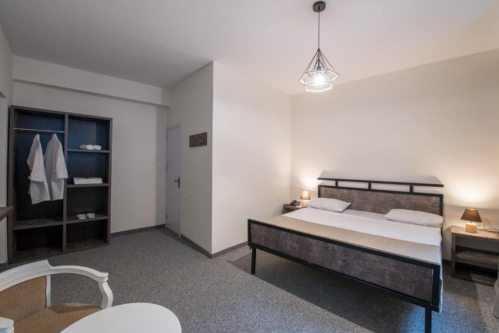 Postel nebo postele na pokoji v ubytování Hotel Opinion