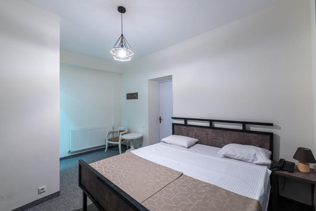Postel nebo postele na pokoji v ubytování Hotel Opinion