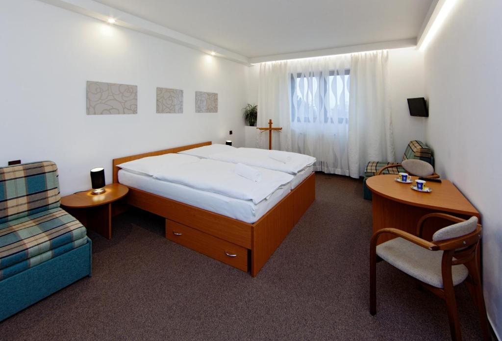 Postel nebo postele na pokoji v ubytování Hotel Wolf