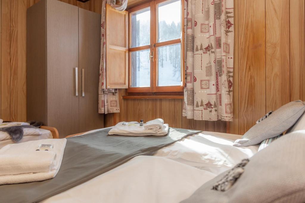 Postel nebo postele na pokoji v ubytování Hotel Monte Triplex