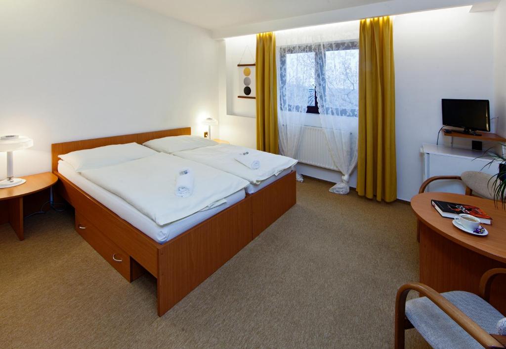 Postel nebo postele na pokoji v ubytování Hotel Wolf