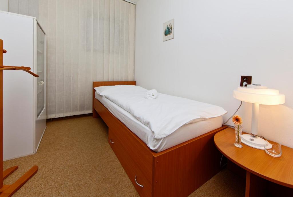 Postel nebo postele na pokoji v ubytování Hotel Wolf
