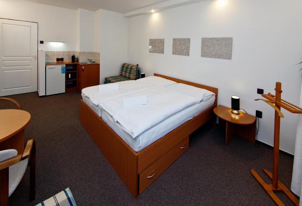 Postel nebo postele na pokoji v ubytování Hotel Wolf