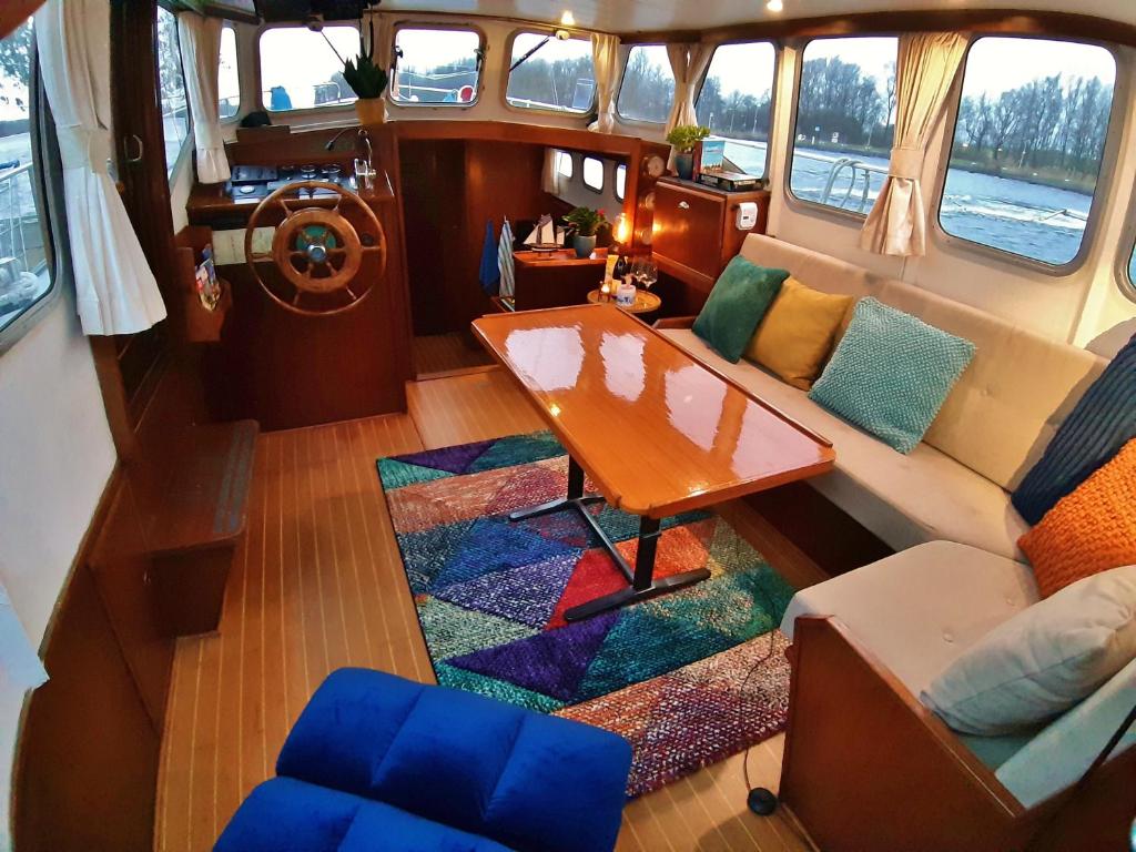 an overhead view of a living room on a boat at Motor Yacht Almaz in Amsterdam