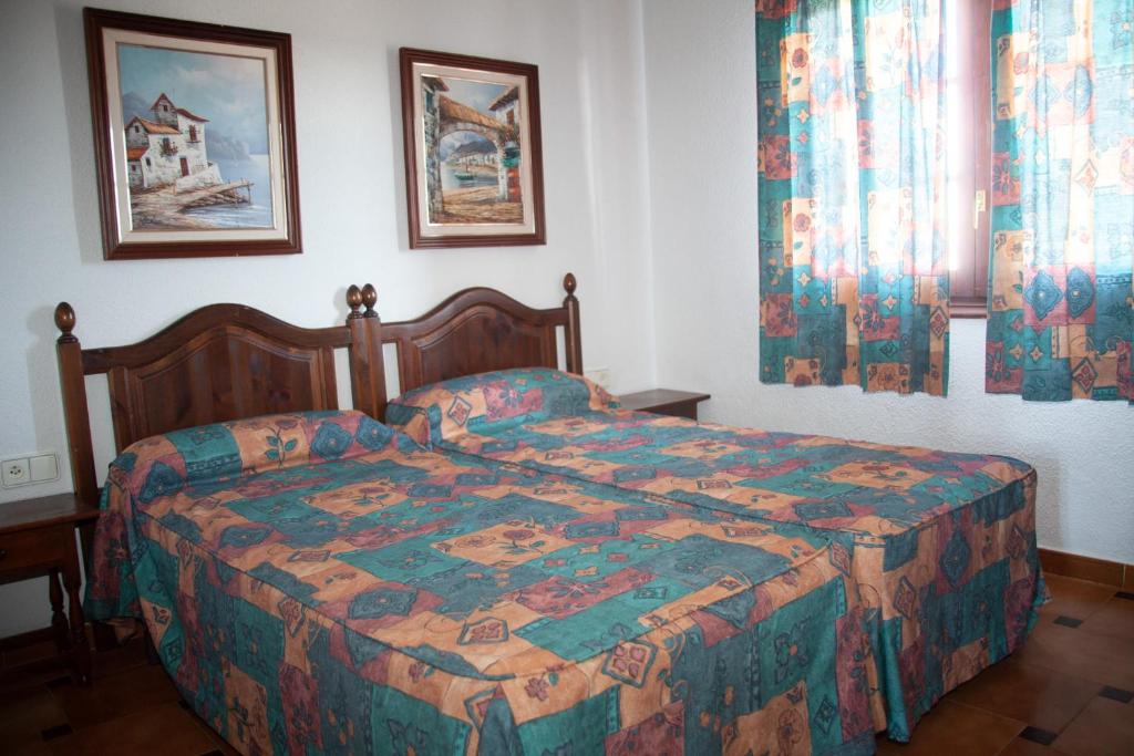 Katil atau katil-katil dalam bilik di Homenfun Menorca Cala en Porter