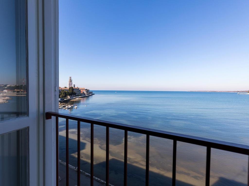 a view of the ocean from a balcony at Bella Vista Premium Apartment in Poreč