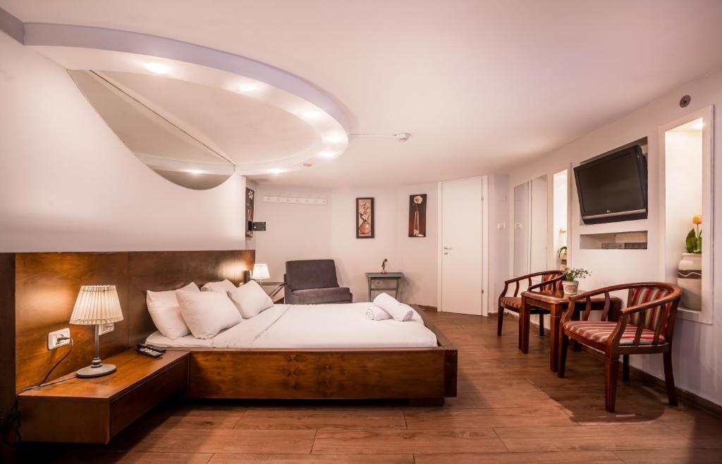 Postel nebo postele na pokoji v ubytování Avital Hotel