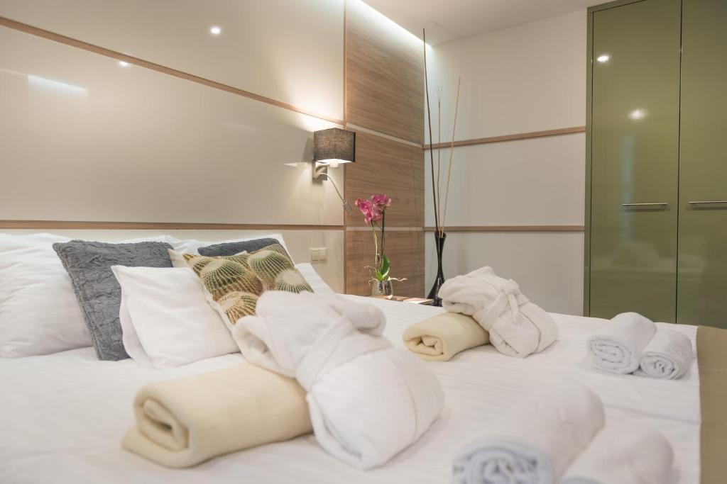 Postel nebo postele na pokoji v ubytování Hotel Zena Beauty & Shopping Center