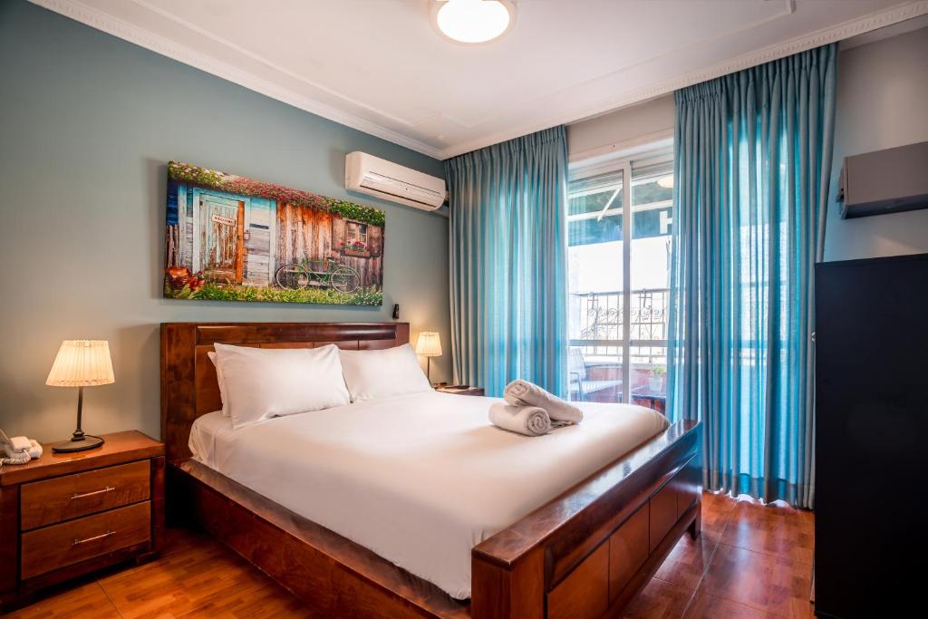 Postel nebo postele na pokoji v ubytování Avital Hotel