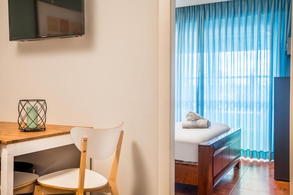 TV a/nebo společenská místnost v ubytování Avital Hotel