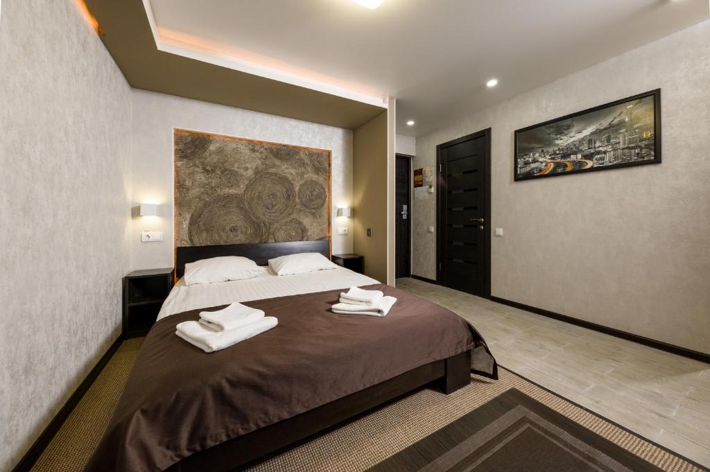 Ένα ή περισσότερα κρεβάτια σε δωμάτιο στο Hotel Nivki