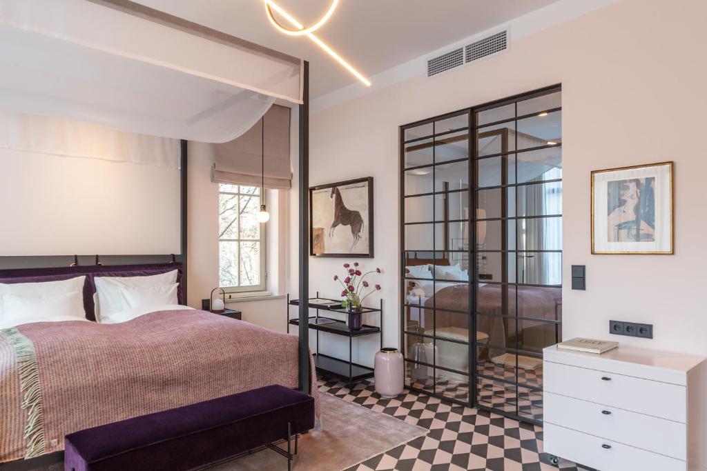 Postel nebo postele na pokoji v ubytování Bagatelle Gardenhouse