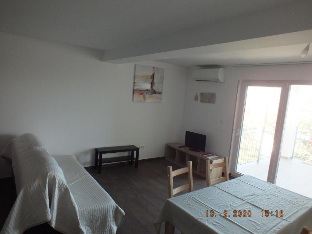 Telewizja i/lub zestaw kina domowego w obiekcie Apartments Amore