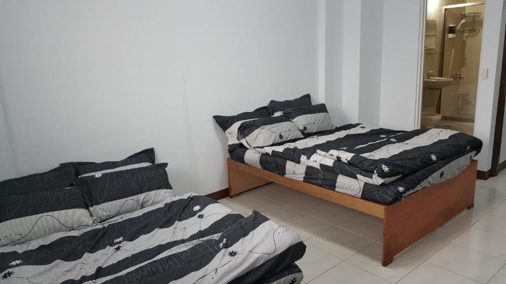 Postel nebo postele na pokoji v ubytování 枋寮小象民宿