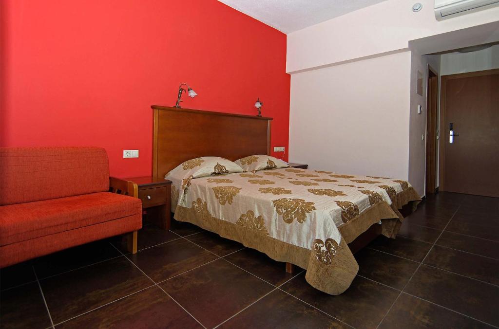 Postel nebo postele na pokoji v ubytování Sun Beach Hotel