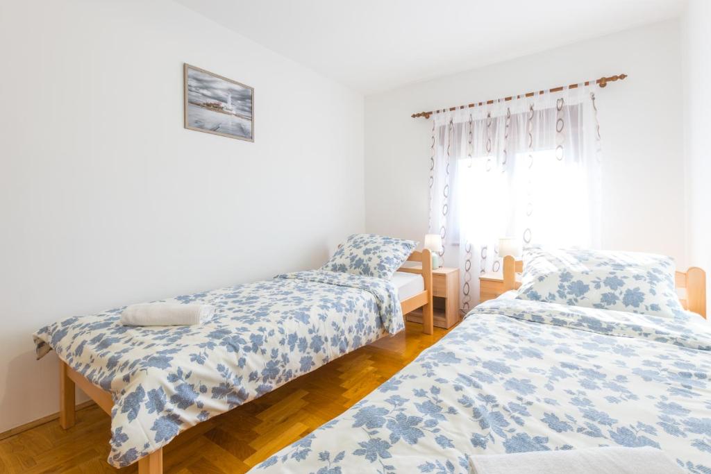 Posteľ alebo postele v izbe v ubytovaní Relaxing apartment Josip - peaceful area