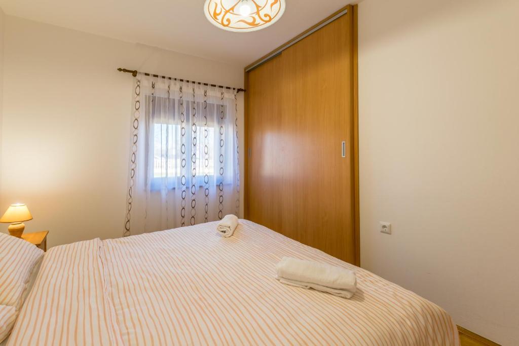 Posteľ alebo postele v izbe v ubytovaní Relaxing apartment Josip - peaceful area