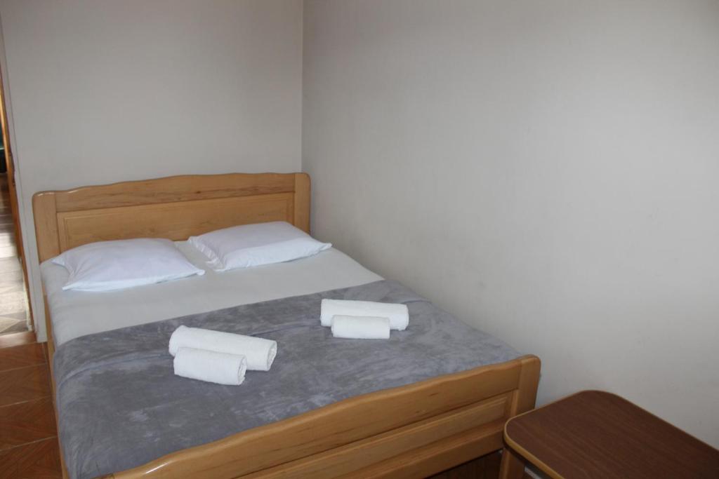 Postel nebo postele na pokoji v ubytování Tornado Hotel