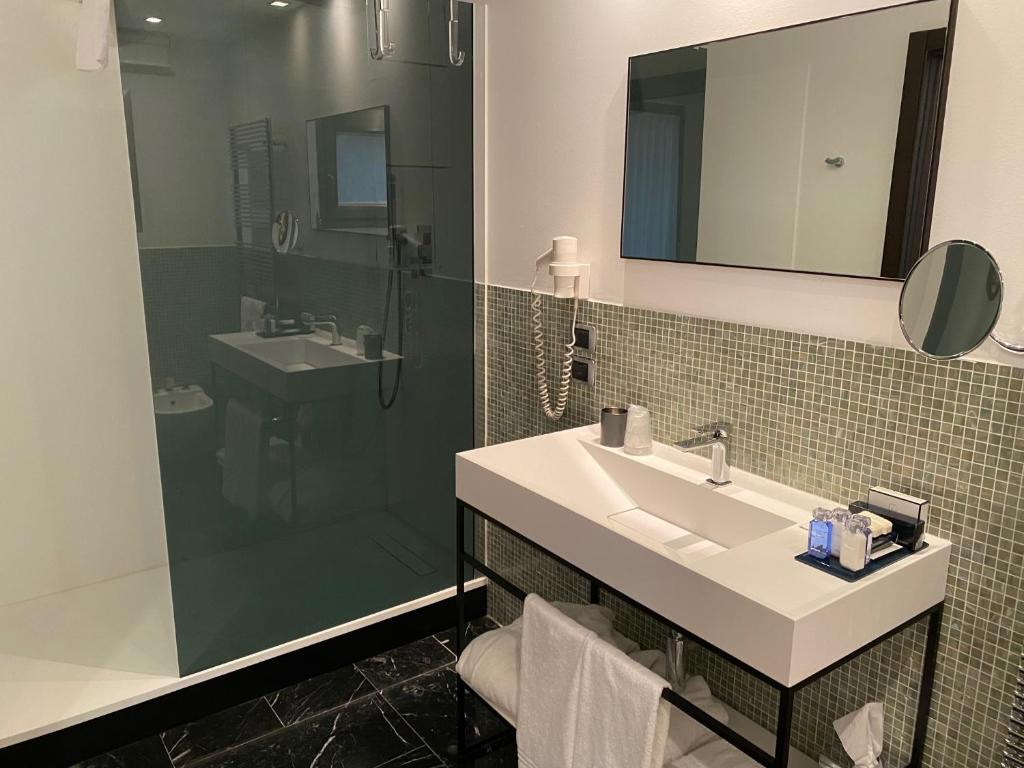 Koupelna v ubytování Postumia Hotel Design
