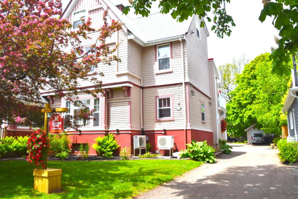 a house with a red and white house at The Harbour House in Charlottetown
