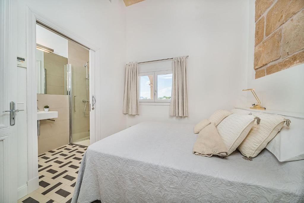 A bed or beds in a room at Beachfront Villa Es Clot by Sealand Villas