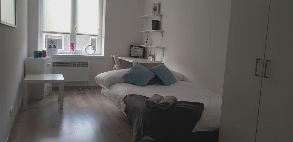 Posteľ alebo postele v izbe v ubytovaní Północna Rooms