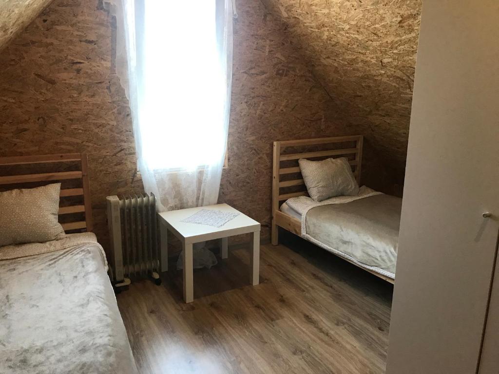 Postel nebo postele na pokoji v ubytování Domki na łowisku Admar w Dąbiu Lubuskim