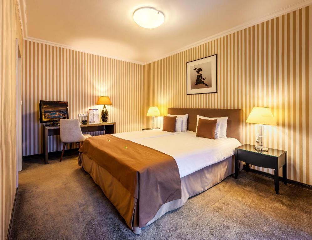 Postel nebo postele na pokoji v ubytování Ambra Hotel
