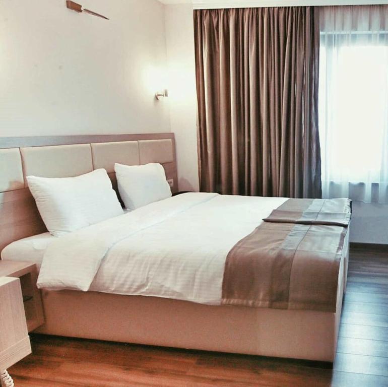 Postel nebo postele na pokoji v ubytování Hotel Vlaho