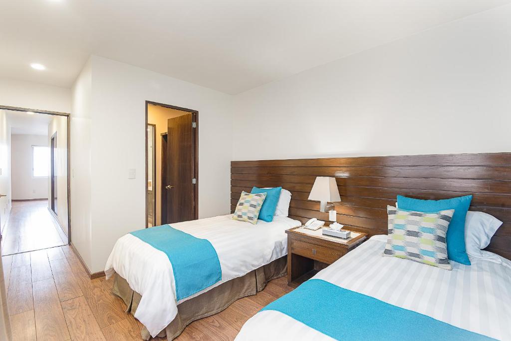 Postel nebo postele na pokoji v ubytování Suites Copérnico Polanco Anzures