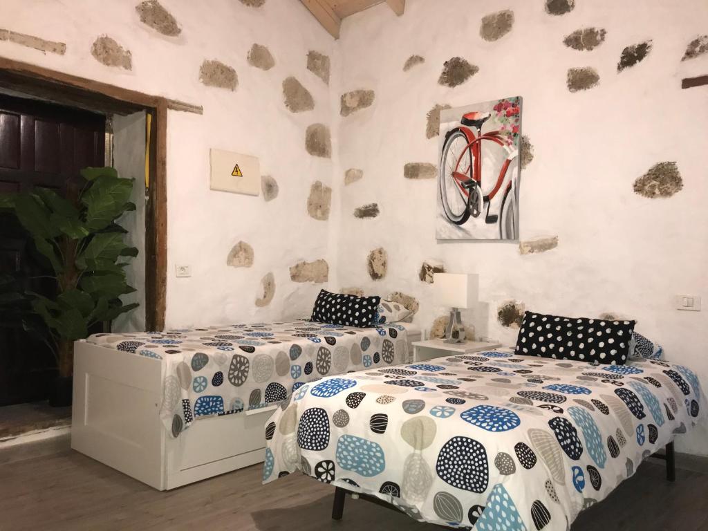 Un pat sau paturi într-o cameră la Casa Doña Carmen