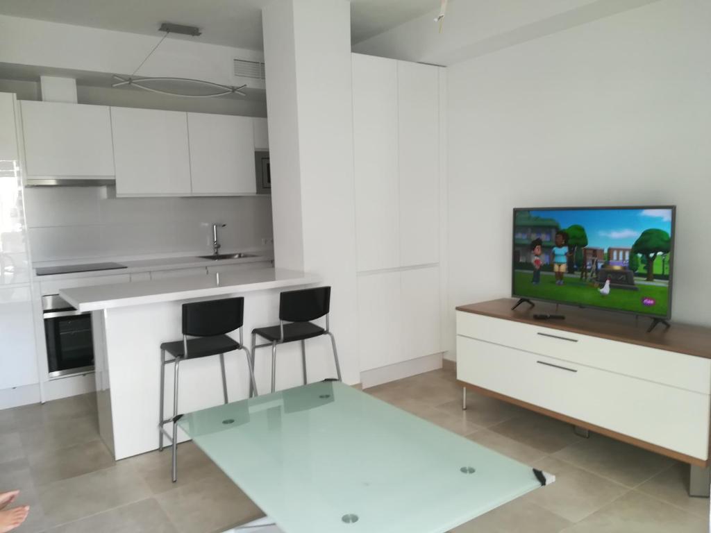 TV a/nebo společenská místnost v ubytování Apartamentos Cachón