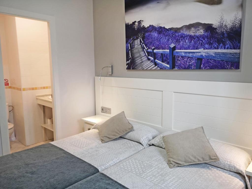 Posteľ alebo postele v izbe v ubytovaní Hostal Bodega