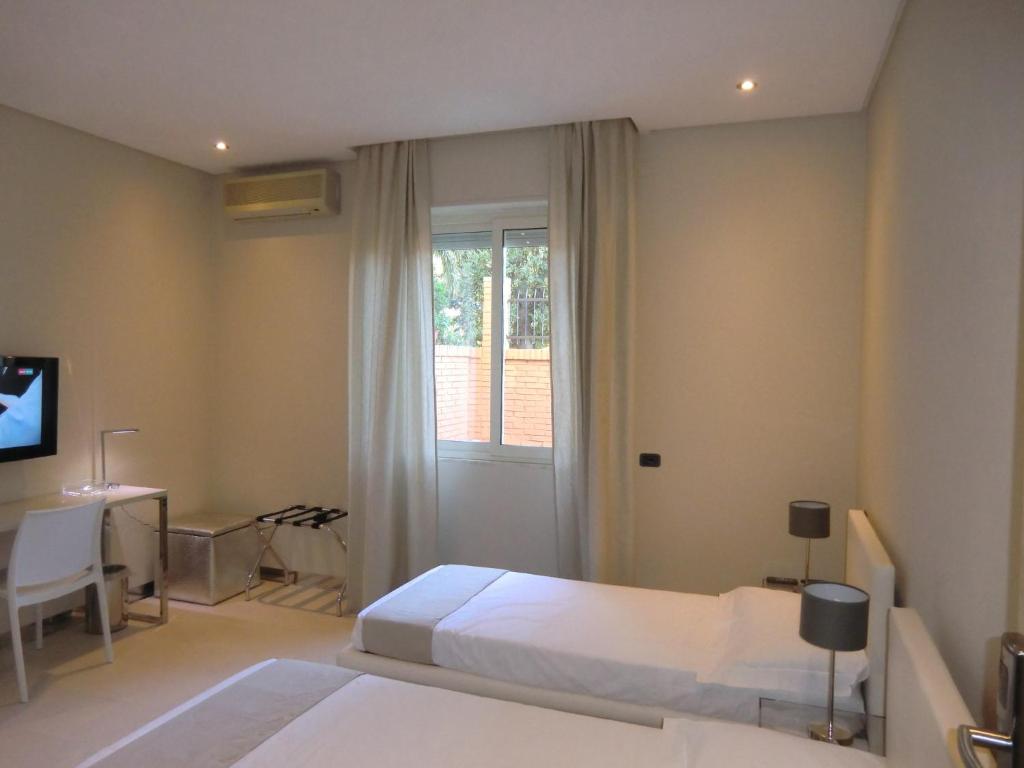 Postel nebo postele na pokoji v ubytování B&Beach Cagliari guest house