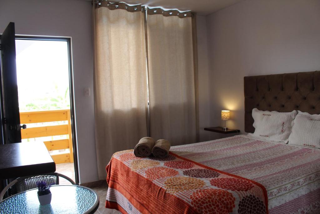 Postel nebo postele na pokoji v ubytování Huacachina Desert House
