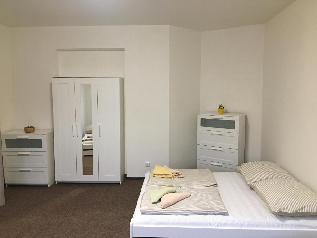 Letto o letti in una camera di Apartmány U Muzea