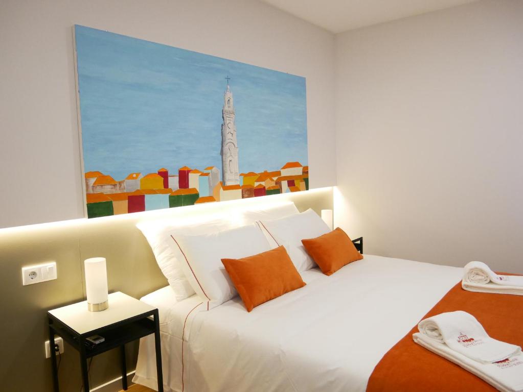 Cama ou camas em um quarto em Serra do Pilar Porto Suites