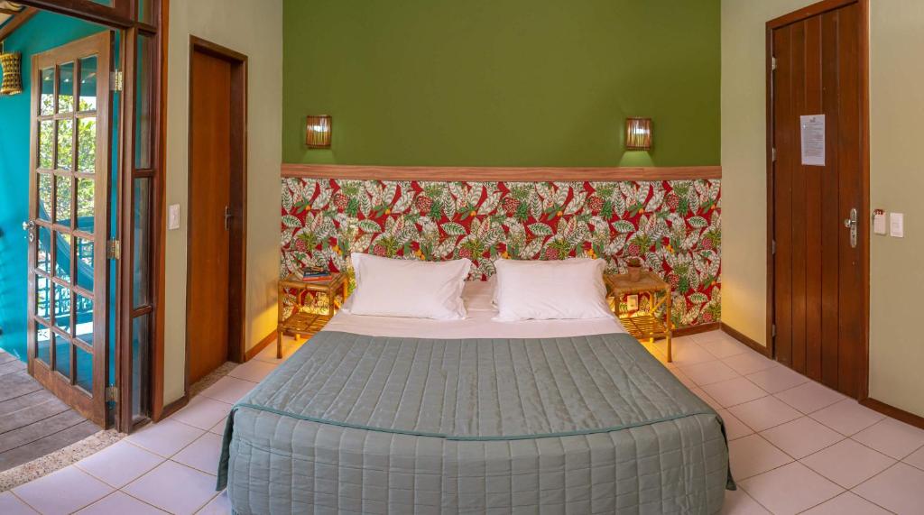 Cama ou camas em um quarto em Pousada Villa Maeva Itacimirim