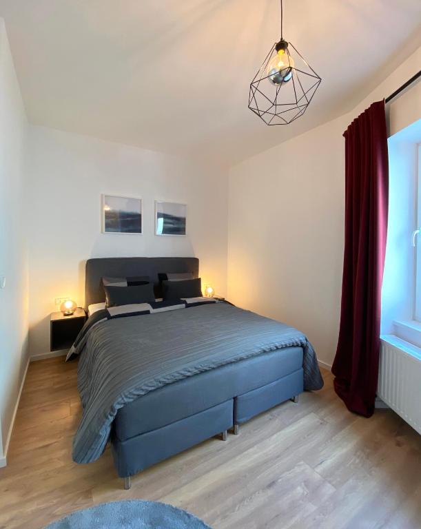 Posteľ alebo postele v izbe v ubytovaní White Inn - Ferienwohnung mit Terrasse